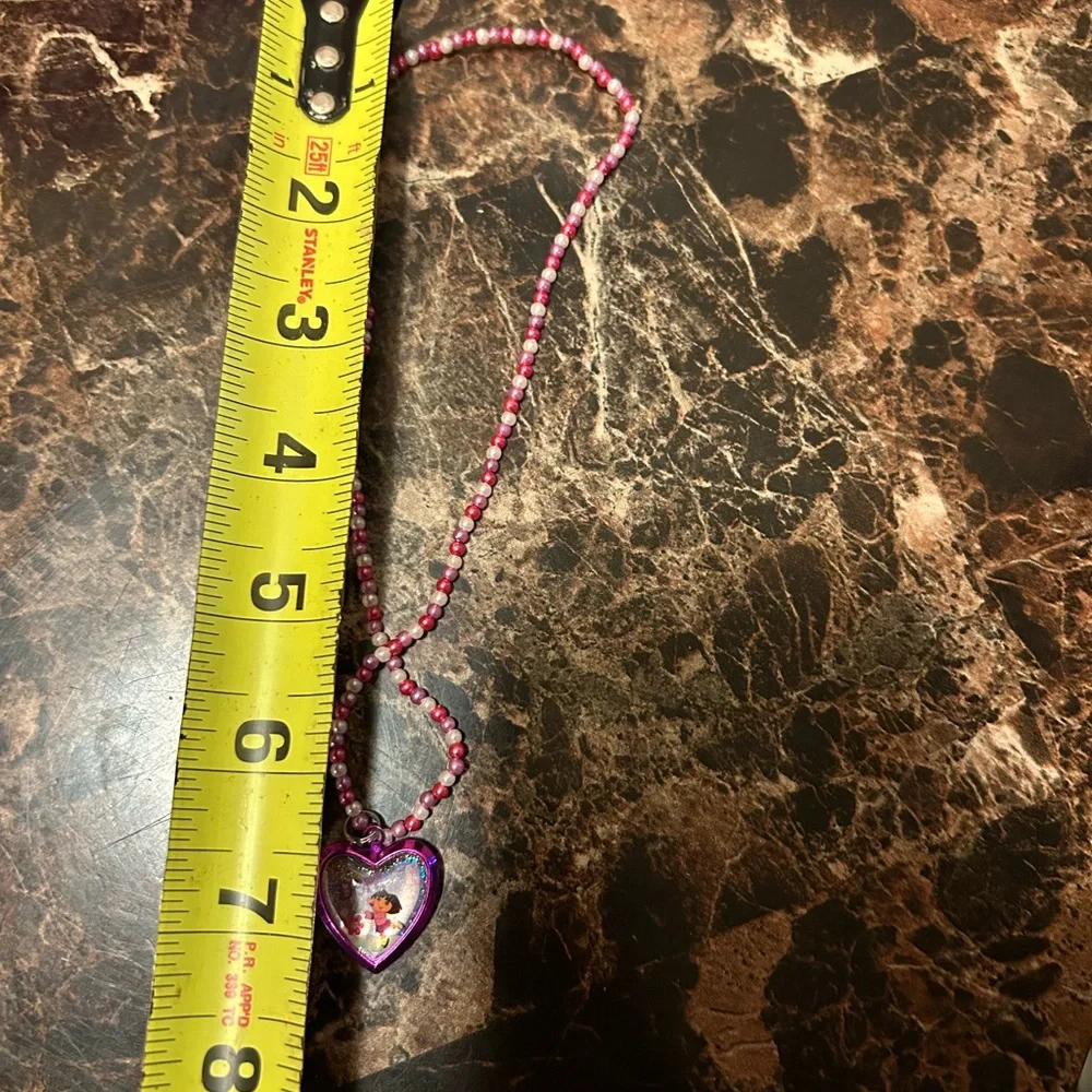 Pink and white beaded necklace with Dora the Explorer locket